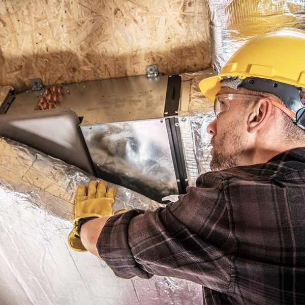 HVAC Worker Finishing Air Duct Insulation